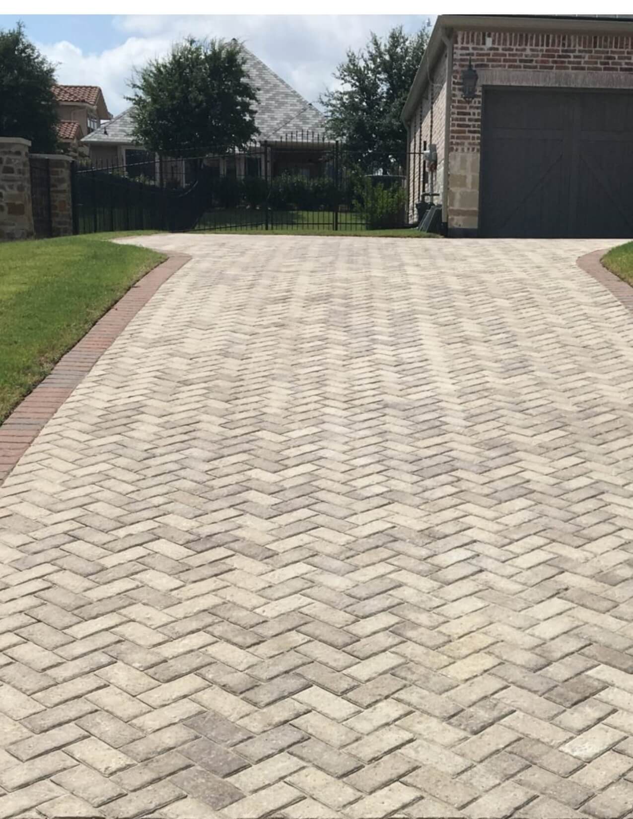 Herringbone brick driveway with pavers