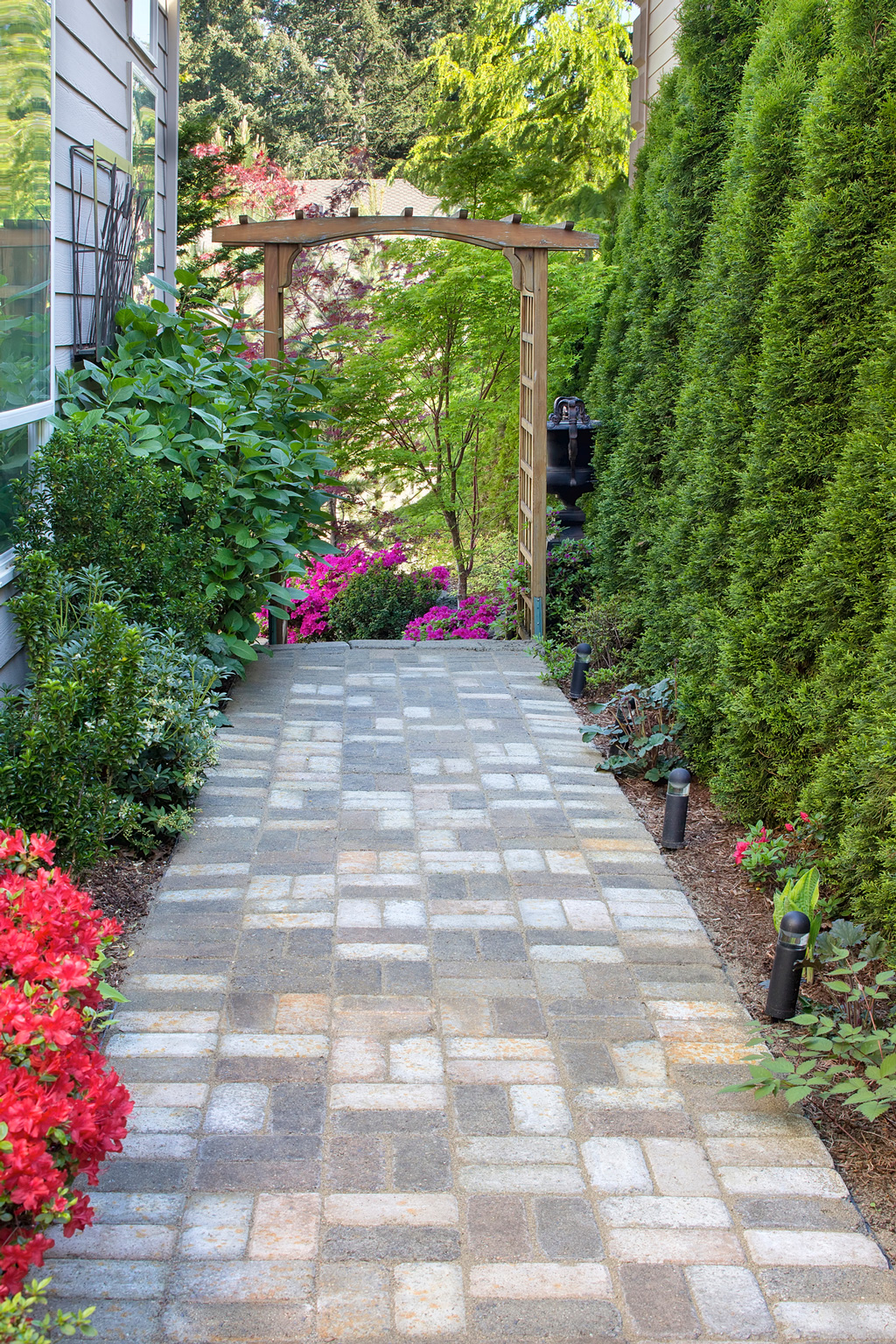 paved side yard with meditation space